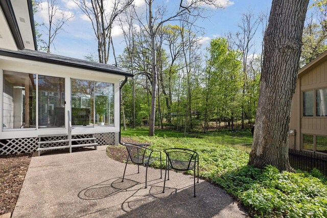 view of patio / terrace with entry steps and a sunroom