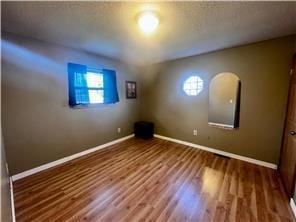 empty room featuring hardwood / wood-style flooring