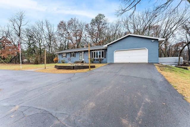 ranch-style home featuring a garage