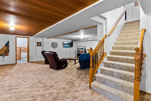 carpeted living room featuring wood ceiling