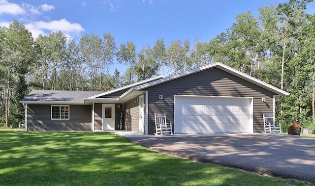 ranch-style home with a garage and a front yard