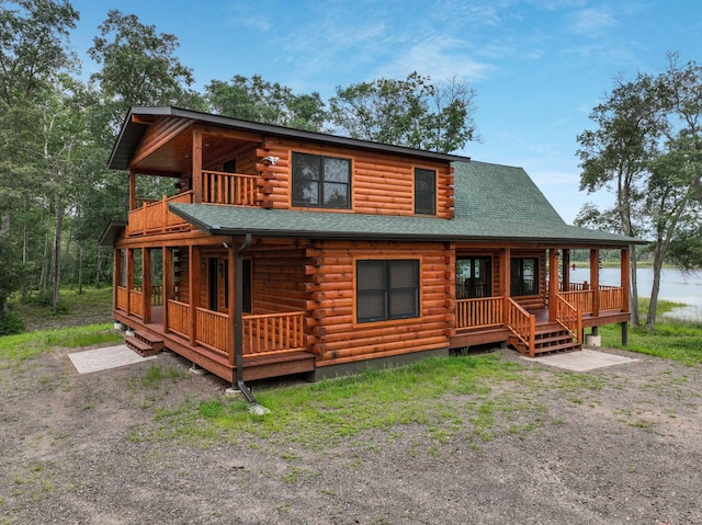 log home featuring a wooden deck