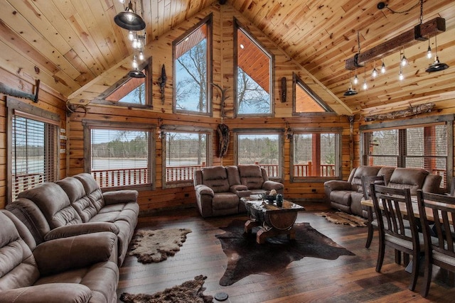 living room with dark wood-type flooring, high vaulted ceiling, and a wealth of natural light