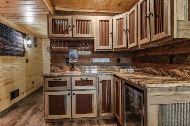 kitchen with wood walls, dark wood-type flooring, beverage cooler, and wood ceiling