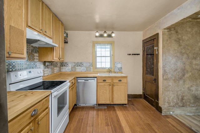 kitchen featuring white electric range, stainless steel dishwasher, a sink, wood counters, and under cabinet range hood