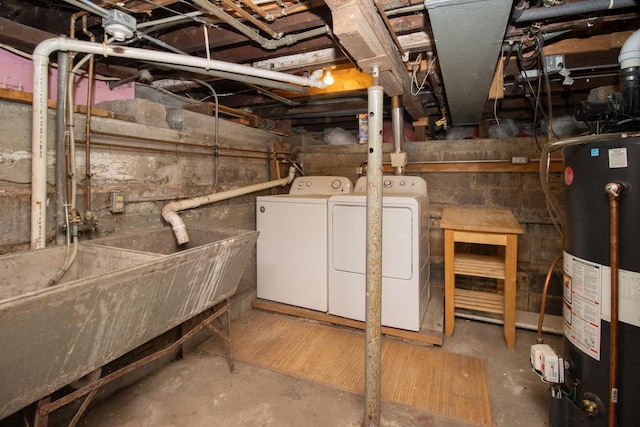 unfinished below grade area with washer and dryer and gas water heater