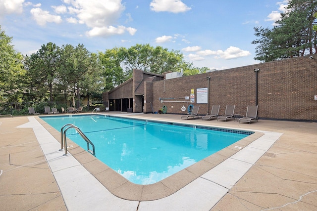 view of pool featuring a patio