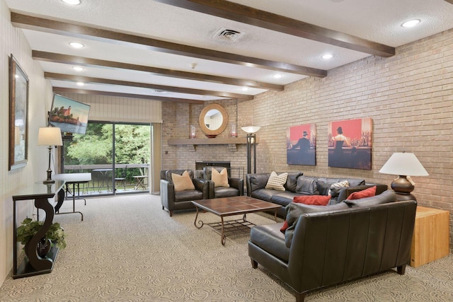 carpeted living room with brick wall, a fireplace, beam ceiling, and a textured ceiling