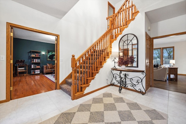 stairs featuring hardwood / wood-style floors