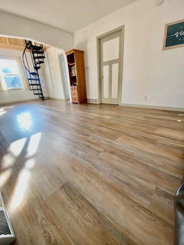 unfurnished room featuring wood-type flooring