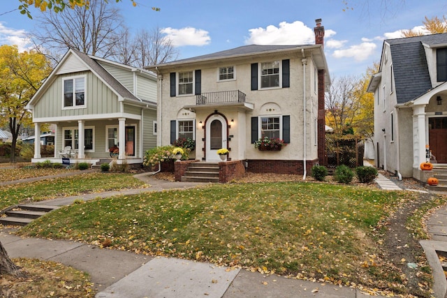 view of front of property with a chimney and a front yard