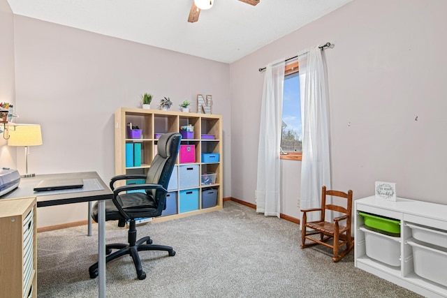 office area with ceiling fan and carpet flooring