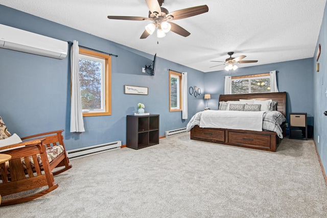 carpeted bedroom with ceiling fan, an AC wall unit, a textured ceiling, and baseboard heating