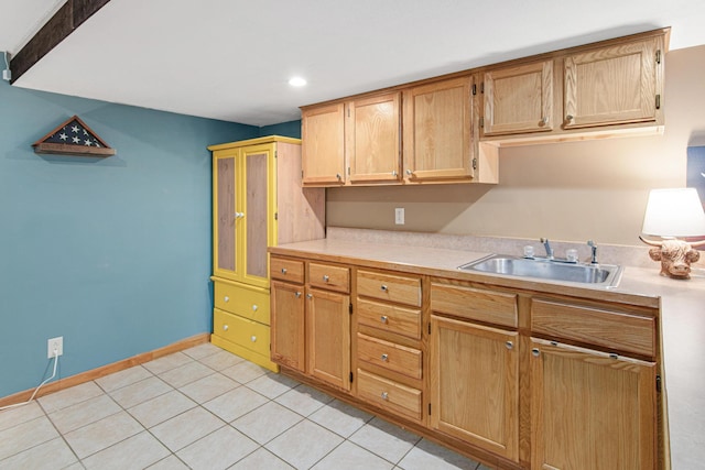 kitchen with sink and light tile patterned floors