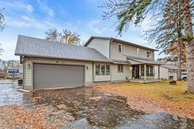 view of front of home with a garage and covered porch