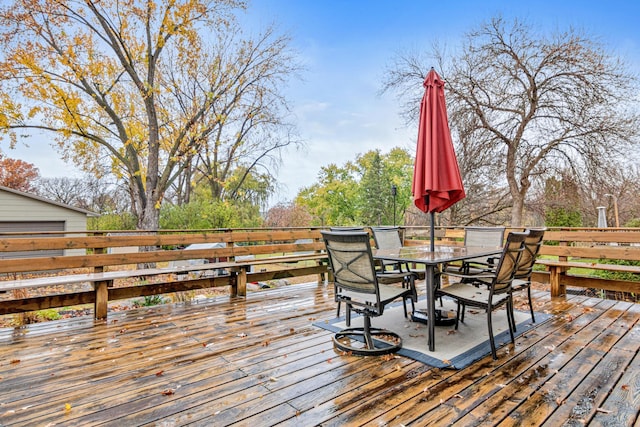 deck featuring outdoor dining area