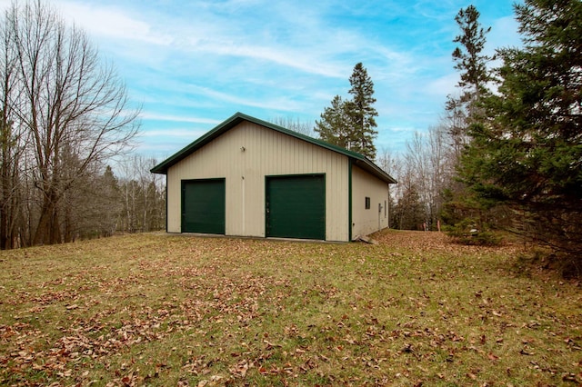 garage with a lawn