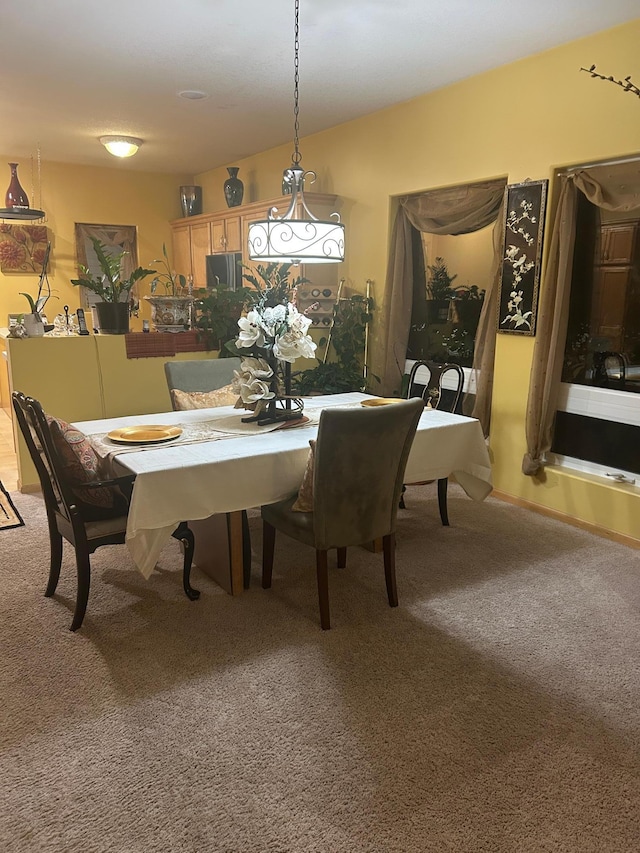 view of carpeted dining space