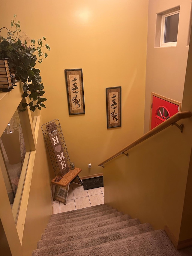 staircase featuring tile patterned floors