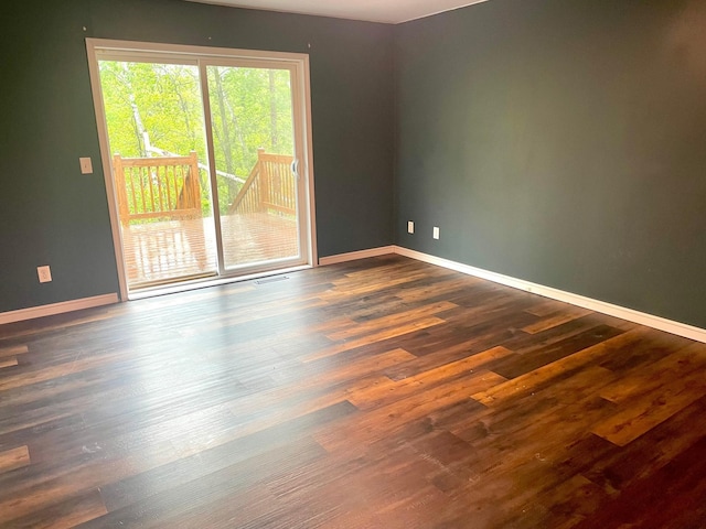12303 71st Ave SW, Motley, MN 56466 - spare room with dark wood-style flooring and baseboards