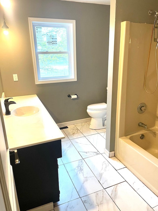12303 71st Ave SW, Motley, MN 56466 - full bath with marble look tiles, baseboards, vanity, and toilet