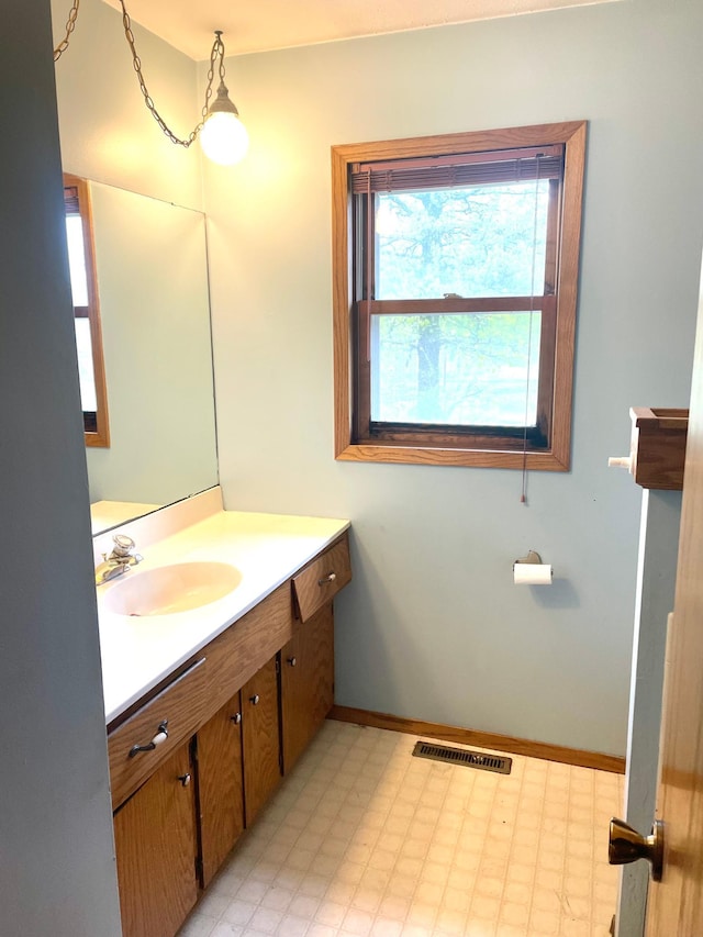 12303 71st Ave SW, Motley, MN 56466 - bathroom featuring vanity, tile patterned floors, and baseboards