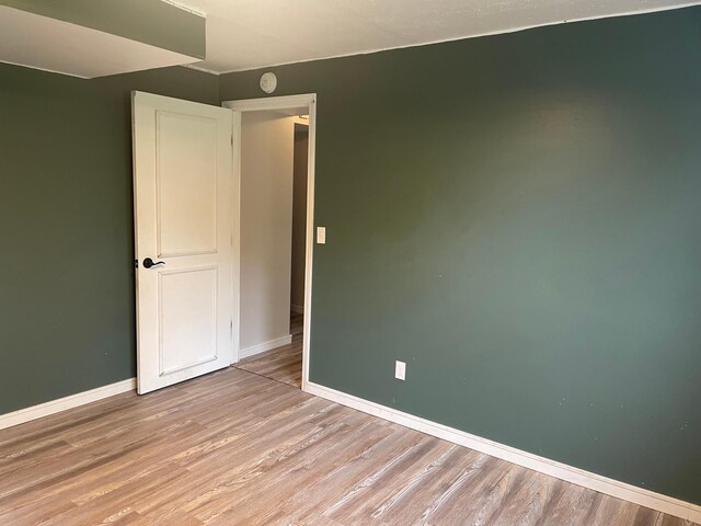 12303 71st Ave SW, Motley, MN 56466 - spare room with light wood-style floors, baseboards, and a smoke detector
