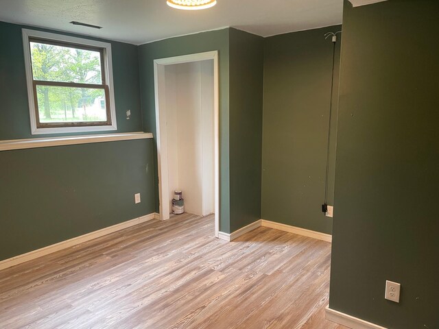 12303 71st Ave SW, Motley, MN 56466 - unfurnished bedroom featuring wood finished floors and baseboards