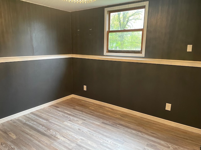 12303 71st Ave SW, Motley, MN 56466 - spare room with wood finished floors and baseboards