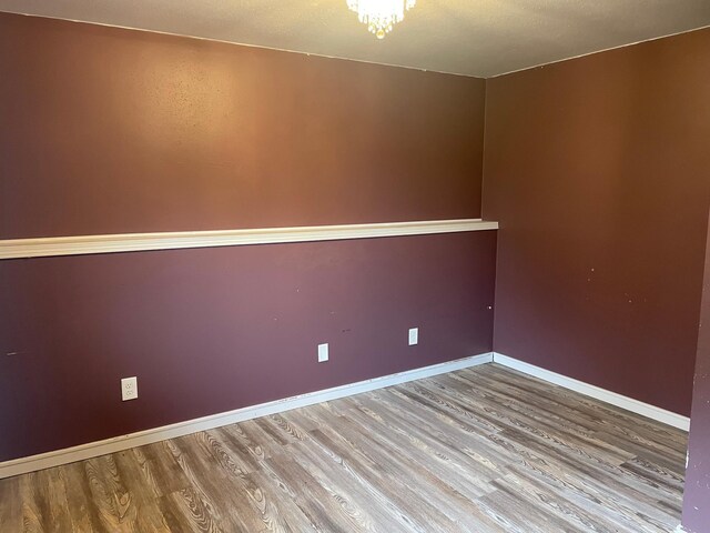 12303 71st Ave SW, Motley, MN 56466 - spare room with wood finished floors and baseboards