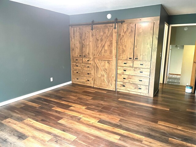12303 71st Ave SW, Motley, MN 56466 - unfurnished bedroom with wood finished floors and baseboards