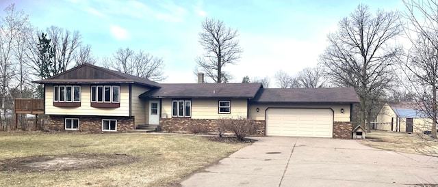 12303 71st Ave SW, Motley, MN 56466 - split level home featuring brick siding, concrete driveway, an attached garage, a front yard, and a chimney