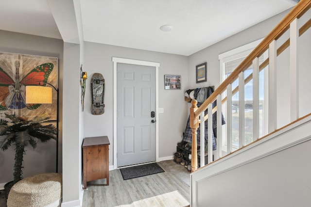 entryway featuring light wood-type flooring and a wealth of natural light