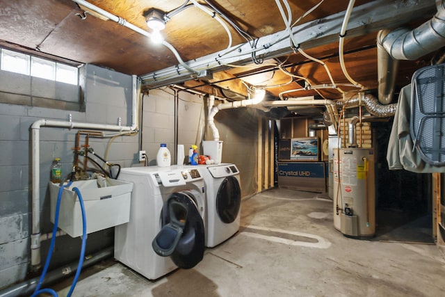 laundry room featuring washer and dryer, gas water heater, and sink