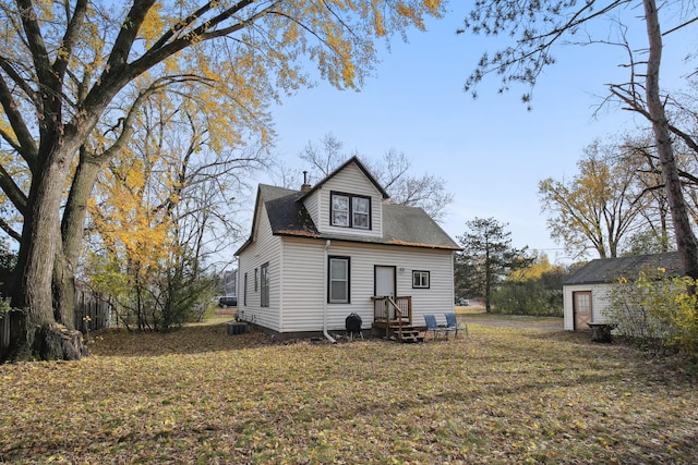 back of property featuring a yard