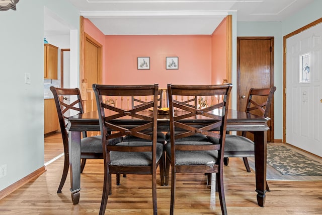 dining area with light hardwood / wood-style flooring