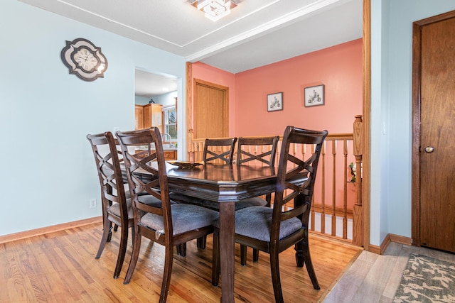 dining space with light wood-type flooring