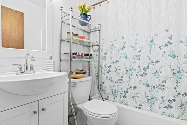 full bathroom featuring toilet, vanity, and shower / bath combo with shower curtain