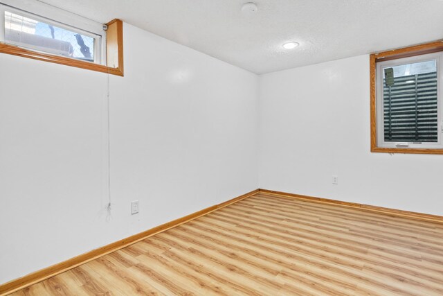 4425 2nd St NE, Columbia Heights, MN 55421 - spare room featuring wood finished floors and baseboards