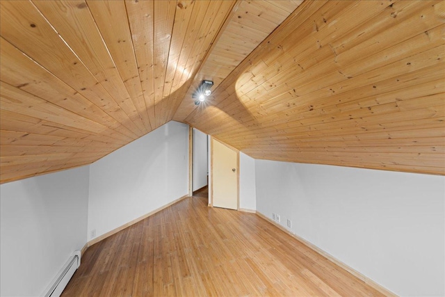 additional living space with wood ceiling, a baseboard radiator, lofted ceiling, and light hardwood / wood-style floors