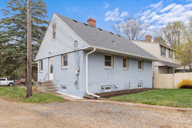 view of home's exterior featuring a yard