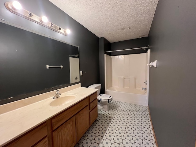 full bathroom with shower / tub combination, vanity, toilet, and a textured ceiling