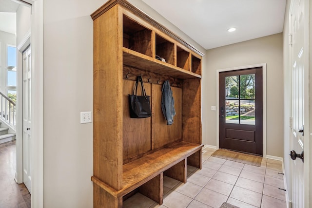 mudroom featuring recessed lighting, baseboards, and light tile patterned floors