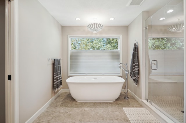 full bath featuring recessed lighting, a soaking tub, visible vents, a shower stall, and baseboards