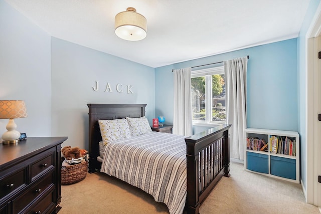 bedroom with light colored carpet