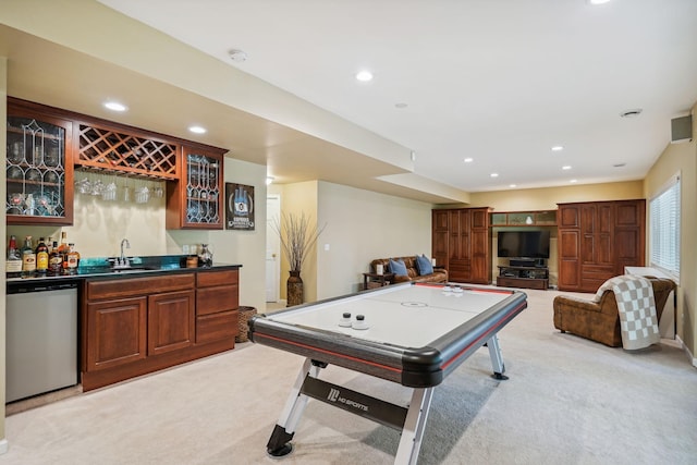 playroom featuring light colored carpet, indoor wet bar, a sink, and recessed lighting