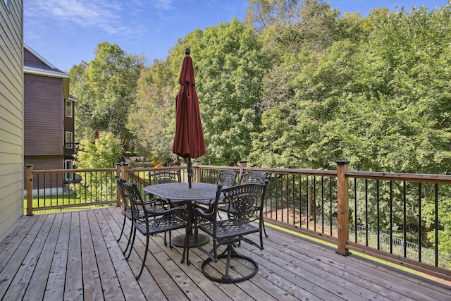 wooden deck with outdoor dining space