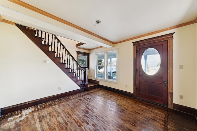 foyer with crown molding and dark hardwood / wood-style floors