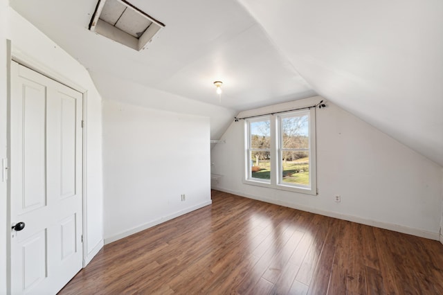 bonus room featuring dark hardwood / wood-style flooring and lofted ceiling