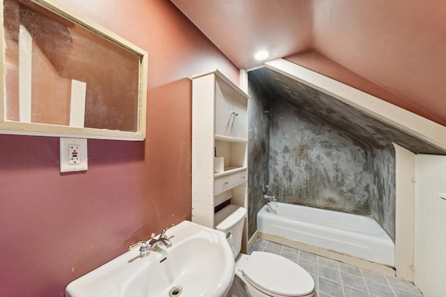 bathroom with toilet, a tub to relax in, tile patterned floors, and sink